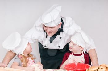 male chef tells the children something