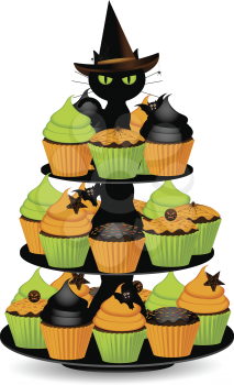 orange, green and black halloween cupcakes on a stand with black cat wearing a wtich's hat