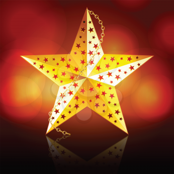 Gold Christmas star with chain reflected on a glossy surface with glowing circle red background