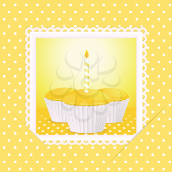Card with yellow cupcakes and candle slotted in to background