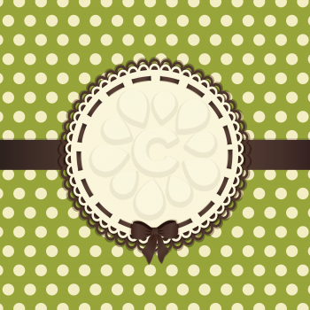 Green polka dot background with cream border and brown ribbon