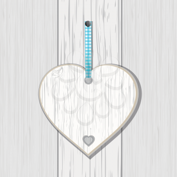 Wooden heart sign on a white wood panel background