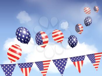 USA balloons floating in a blue sky over flag bunting