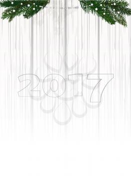 Twenty Seventeen in Numbers Over Shaded White Wood Background with Pine Tree Branches and Decoration