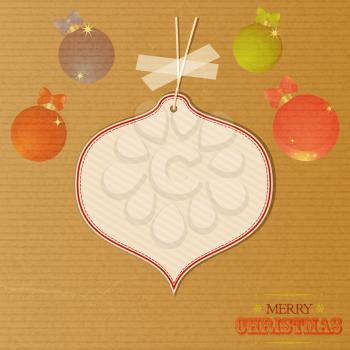 Merry Christmas Brown Paper Background with Baubles Text and Blank Tag Hanging with Sellotape for Your Messages 