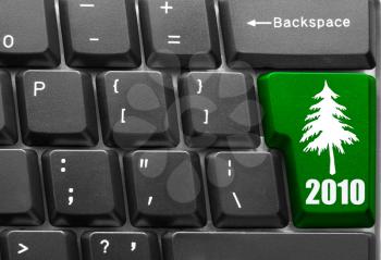 Royalty Free Photo of a Keyboard with a 2010 Christmas Tree Button