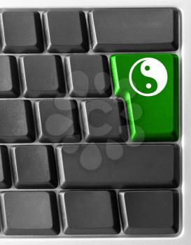 Royalty Free Photo of a  Computer Keyboard With a Ying Yang Key