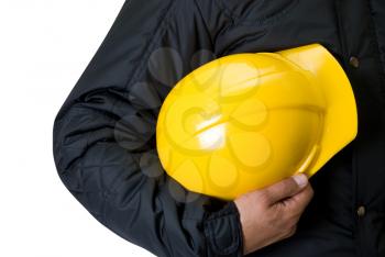 Royalty Free Photo of a Man Holding a Yellow Hardhat 