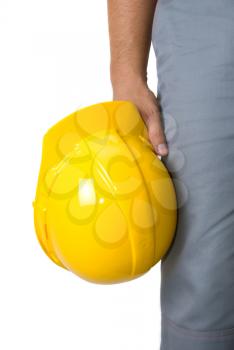 Royalty Free Photo of a Man Holding a Yellow Hardhat 