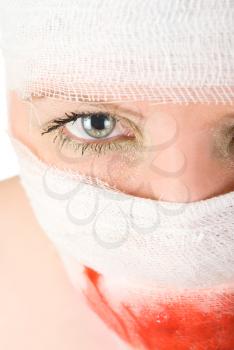 Royalty Free Photo of a Woman With Bandages With Blood on Her Face