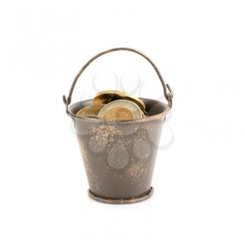 bucket full of coins isolated on a white