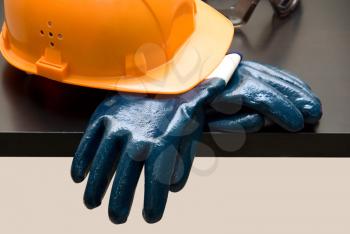 Royalty Free Photo of an Orange Hardhat and Gloves