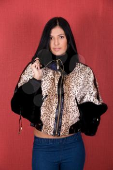 Royalty Free Photo of a Woman Wearing a Leopard Print Coat 