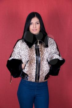 Royalty Free Photo of a Woman Wearing a Leopard Print Coat 