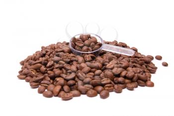 coffee beans with spoon on a white background