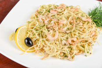 Royalty Free Photo of Pasta With Shrimp and Lemons 