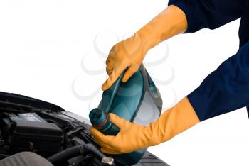 Royalty Free Photo of a Person Putting Oil in their Car
