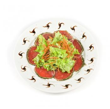 red beef sliced meat with greens isolated on a white background