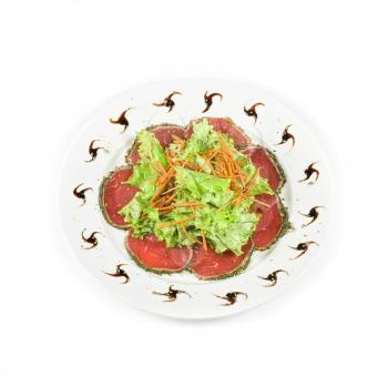 red beef sliced meat with greens isolated on a white background