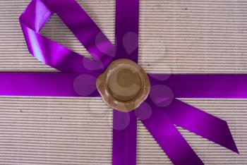 Royalty Free Photo of a Wax Seal on a Gift Box