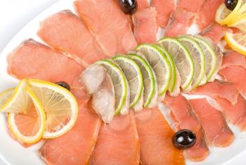 Royalty Free Photo of Salmon and Mackerel With Limes, Lemons and Olives