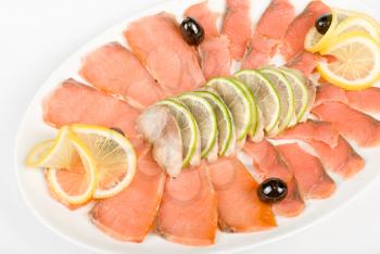 Royalty Free Photo of Salmon and Mackerel With Limes, Lemons and Olives