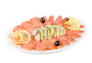 Sliced chum salmon and mackerel decorated with limes, lemons and olives
