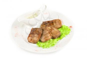 Beef tongue with sauce isolated on a white background