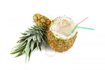 Milk cocktail with pineapple as cup on a white