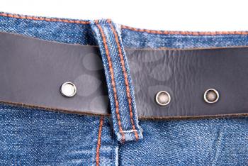 Royalty Free Photo of a Belt on Blue Jeans