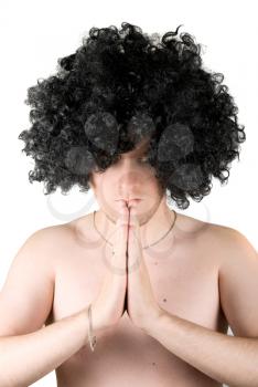 Royalty Free Photo of a Man Wearing a Wig Praying