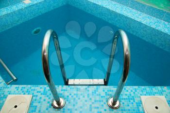Royalty Free Photo of a Swimming Pool Ladder 