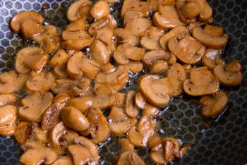Royalty Free Photo of Mushrooms Roasting in a Pan