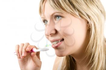 Royalty Free Photo of a Woman Brushing Her Teeth