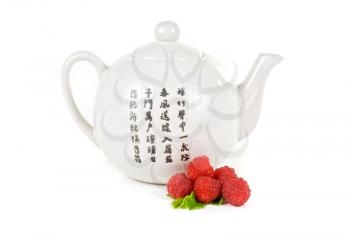 Royalty Free Photo of a Teapot and Berries