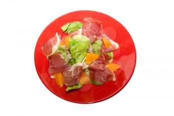 Salad: jamon with orange fruit and lettuce at red dish on white.
It is very delicious.
