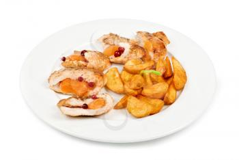 Roast chicken meat with apricot and potato closeup