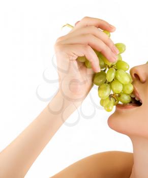 Royalty Free Photo of a Woman Eating Grapes