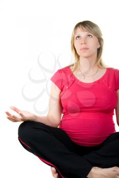 Royalty Free Photo of a Pregnant Woman Meditating
