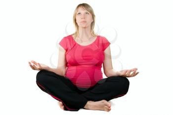 Royalty Free Photo of a Pregnant Woman Meditating