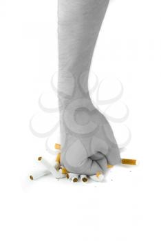 Royalty Free Photo of a Fist Crushing Cigarettes