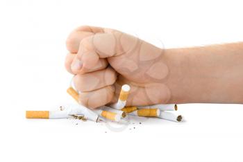 Royalty Free Photo of a Fist Crushing Cigarettes