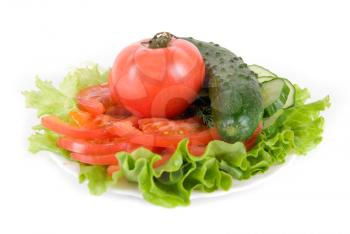 Healthy combination of lettuce, tomato and cucumber on white

