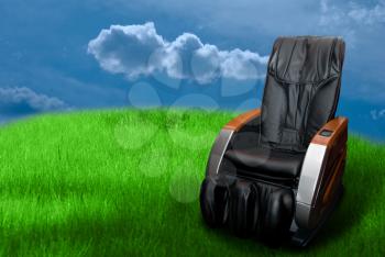 Royalty Free Photo of a Massage Chair in a Field