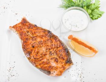 Royalty Free Photo of Grilled Fish With Sauce