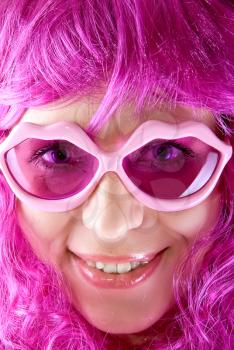 Royalty Free Photo of a Woman Wearing Pink Glasses and Wig