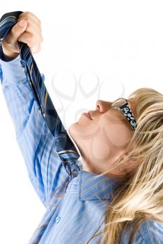 Royalty Free Photo of a Woman Pulling at a Necktie 