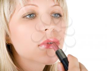 Royalty Free Photo of a Woman Applying Lipstick
