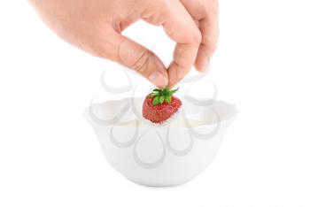 Royalty Free Photo of a Strawberry Dipped in Cream