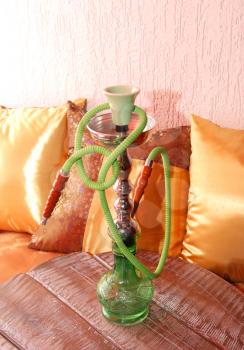 Royalty Free Photo of a Hookah on Pillows